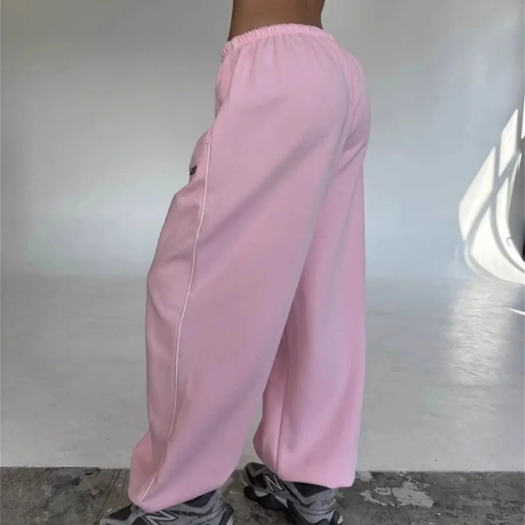 Pantalones retro americanos de moda femenina para otoño y primavera, nuevos en la colección de pantalones anchos a rayas, pantalones deportivos holgados y rectos, estilo casual urbano.