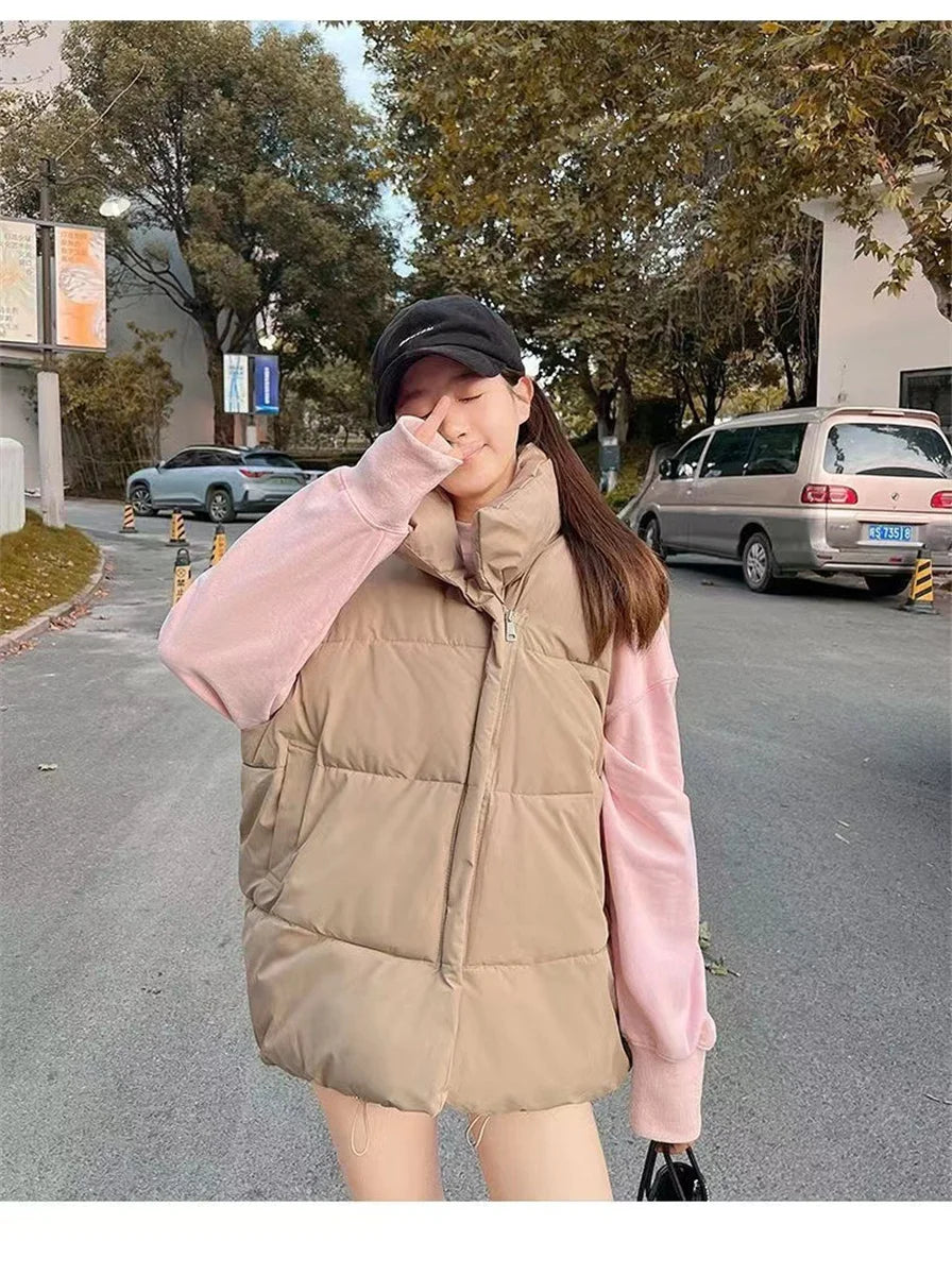 Moda femenina Otoño 2024 Nuevos abrigos de plumas elegantes con cuello alto Prendas de abrigo cálidas Ropa informal Cinturón Sin mangas Chalecos Chaquetas de invierno para mujer