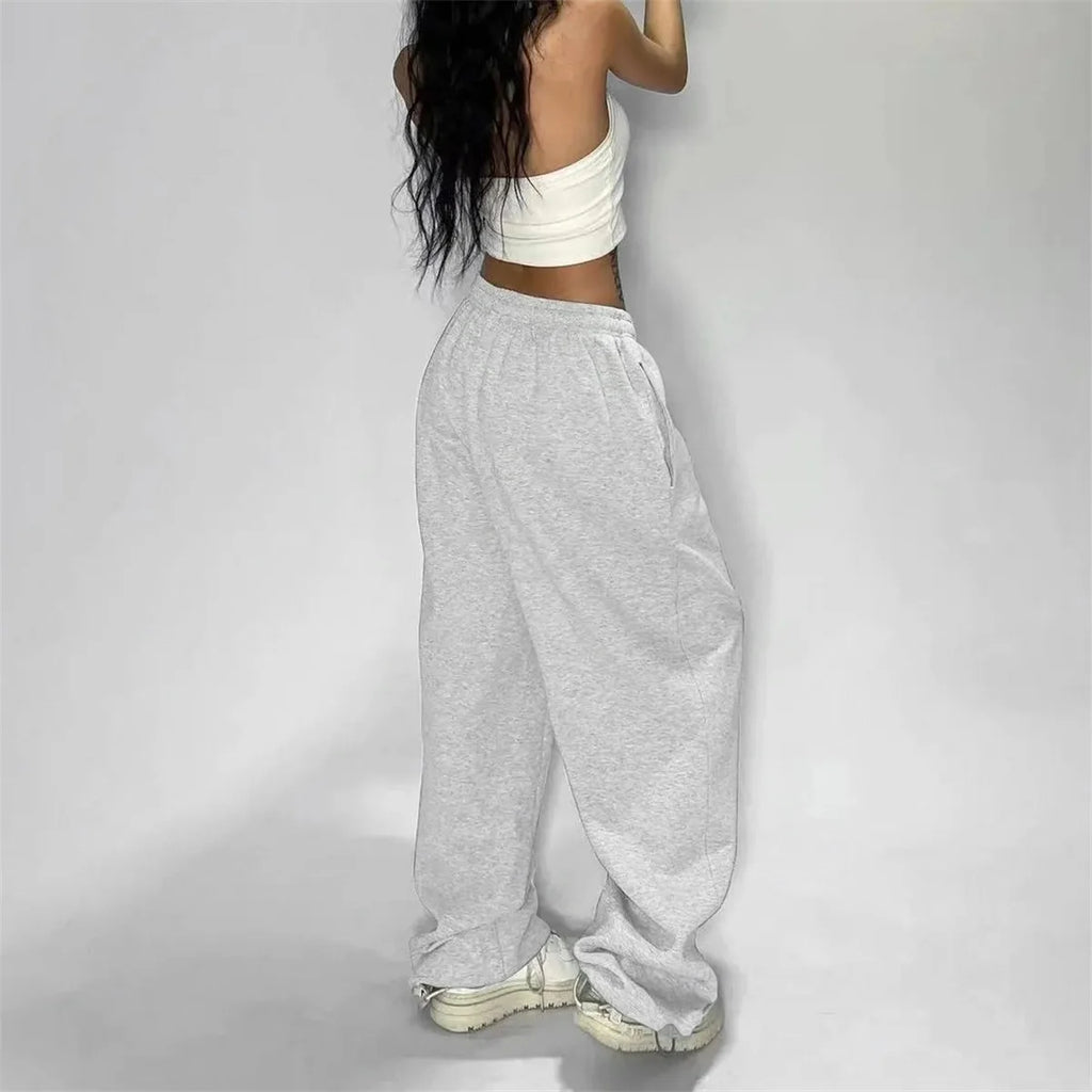 Pantalones retro americanos de moda femenina para otoño y primavera, nuevos en la colección de pantalones anchos a rayas, pantalones deportivos holgados y rectos, estilo casual urbano.