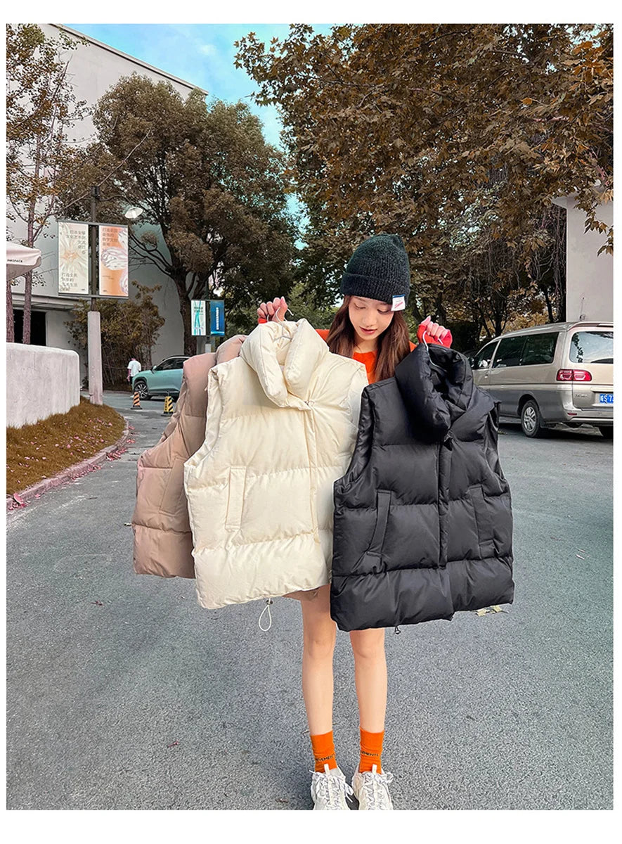 Moda femenina Otoño 2024 Nuevos abrigos de plumas elegantes con cuello alto Prendas de abrigo cálidas Ropa informal Cinturón Sin mangas Chalecos Chaquetas de invierno para mujer