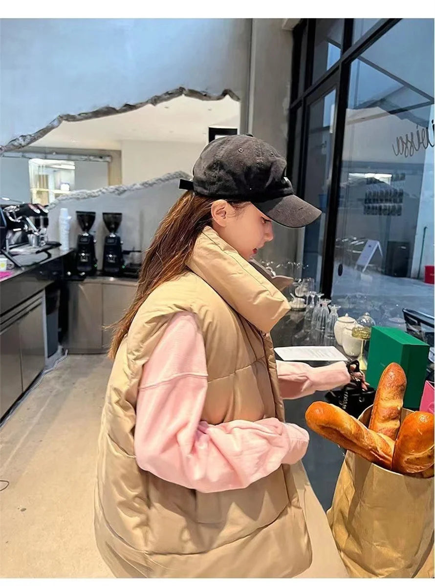 Moda femenina Otoño 2024 Nuevos abrigos de plumas elegantes con cuello alto Prendas de abrigo cálidas Ropa informal Cinturón Sin mangas Chalecos Chaquetas de invierno para mujer