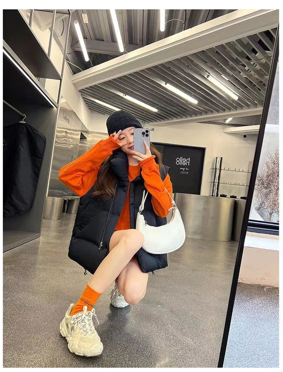 Moda femenina Otoño 2024 Nuevos abrigos de plumas elegantes con cuello alto Prendas de abrigo cálidas Ropa informal Cinturón Sin mangas Chalecos Chaquetas de invierno para mujer
