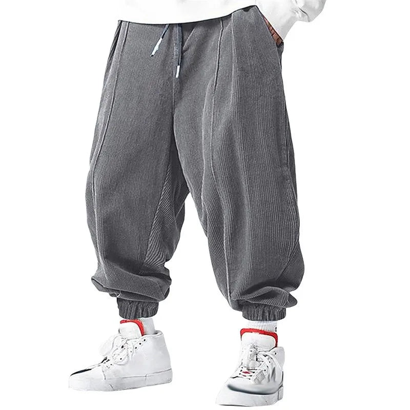 Pantalones casuales holgados con cordón para hombre, ideales para otoño e invierno.