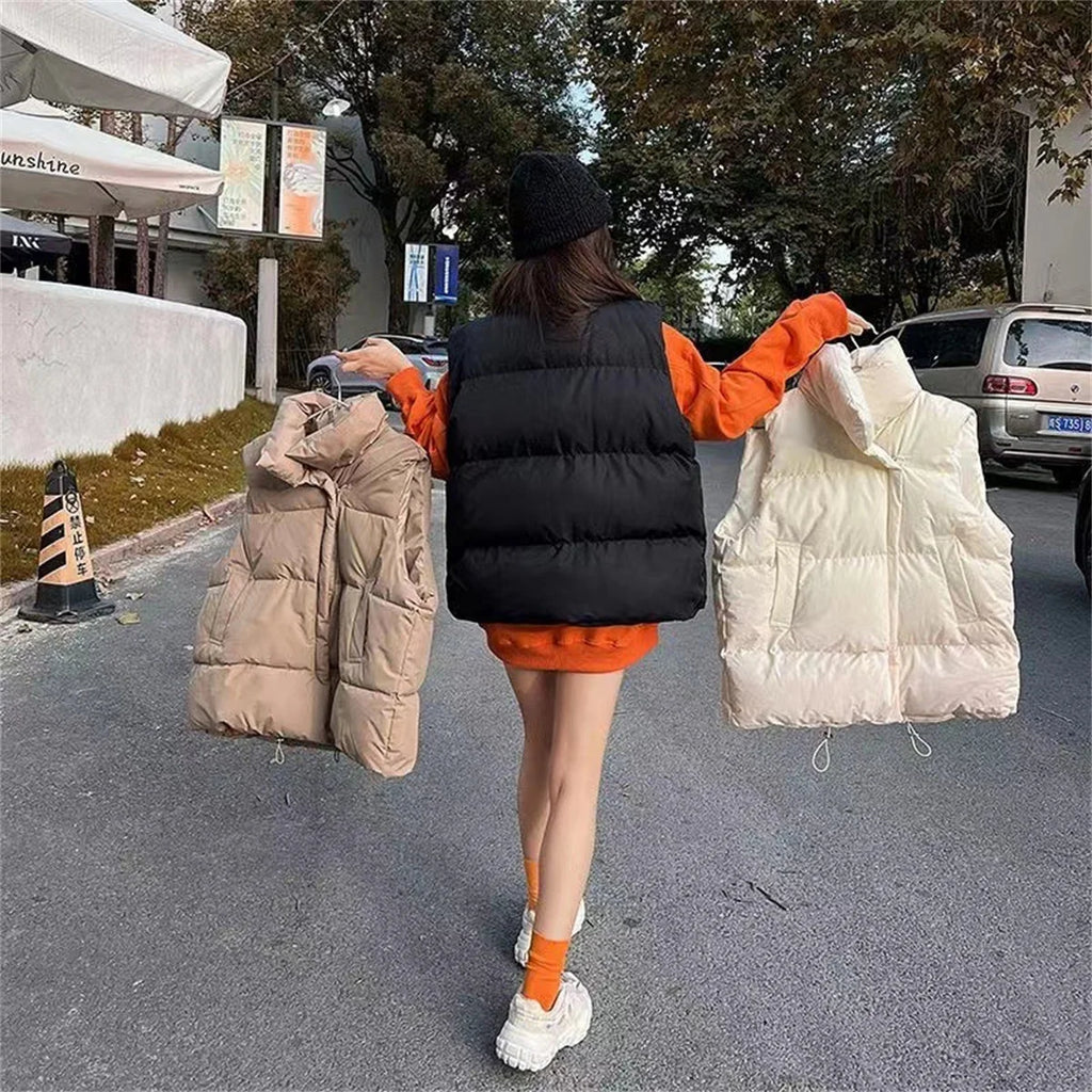 Moda femenina Otoño 2024 Nuevos abrigos de plumas elegantes con cuello alto Prendas de abrigo cálidas Ropa informal Cinturón Sin mangas Chalecos Chaquetas de invierno para mujer