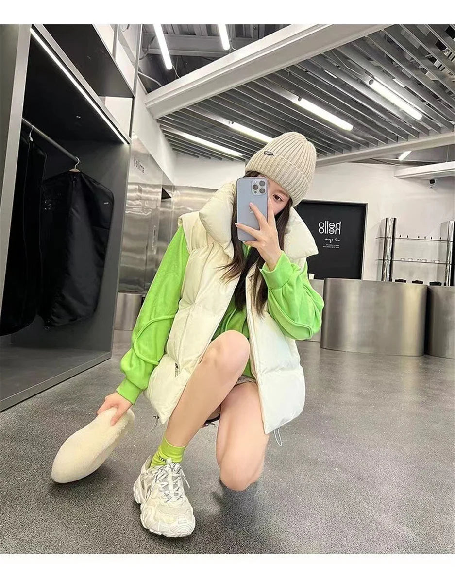 Moda femenina Otoño 2024 Nuevos abrigos de plumas elegantes con cuello alto Prendas de abrigo cálidas Ropa informal Cinturón Sin mangas Chalecos Chaquetas de invierno para mujer