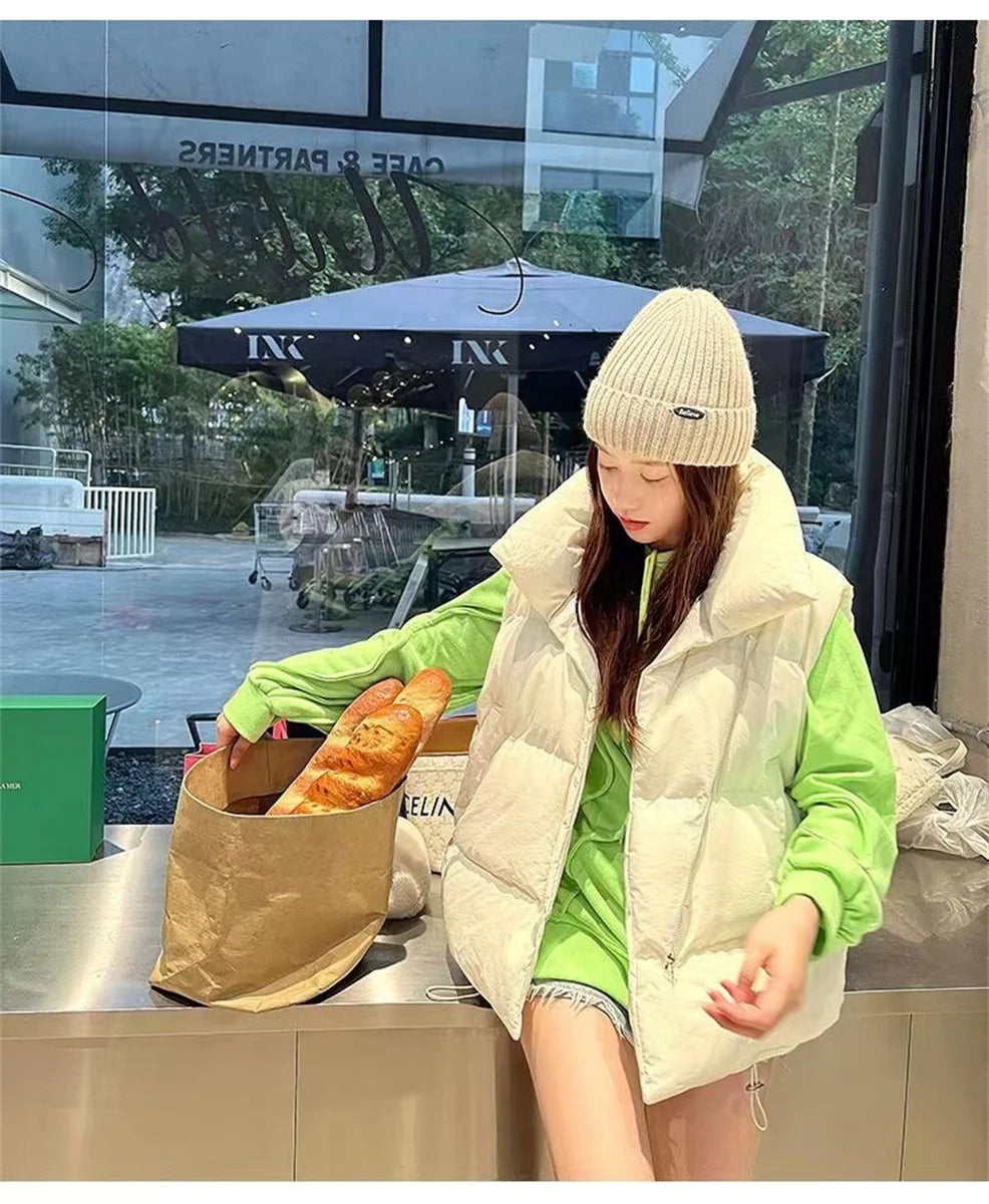 Moda femenina Otoño 2024 Nuevos abrigos de plumas elegantes con cuello alto Prendas de abrigo cálidas Ropa informal Cinturón Sin mangas Chalecos Chaquetas de invierno para mujer