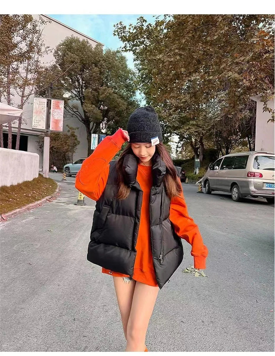 Moda femenina Otoño 2024 Nuevos abrigos de plumas elegantes con cuello alto Prendas de abrigo cálidas Ropa informal Cinturón Sin mangas Chalecos Chaquetas de invierno para mujer