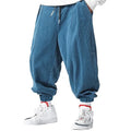 Pantalones casuales holgados con cordón para hombre, ideales para otoño e invierno.