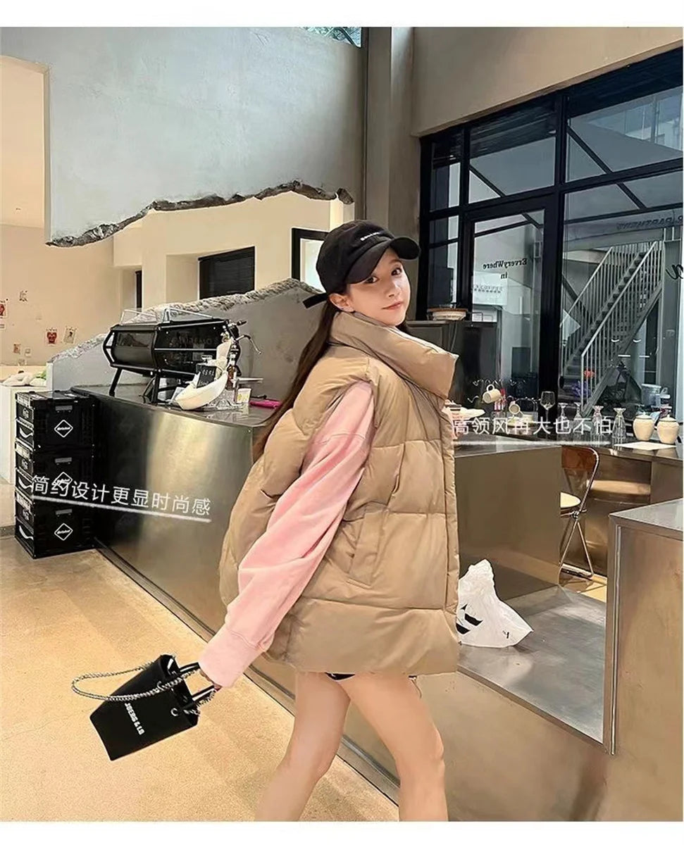 Moda femenina Otoño 2024 Nuevos abrigos de plumas elegantes con cuello alto Prendas de abrigo cálidas Ropa informal Cinturón Sin mangas Chalecos Chaquetas de invierno para mujer