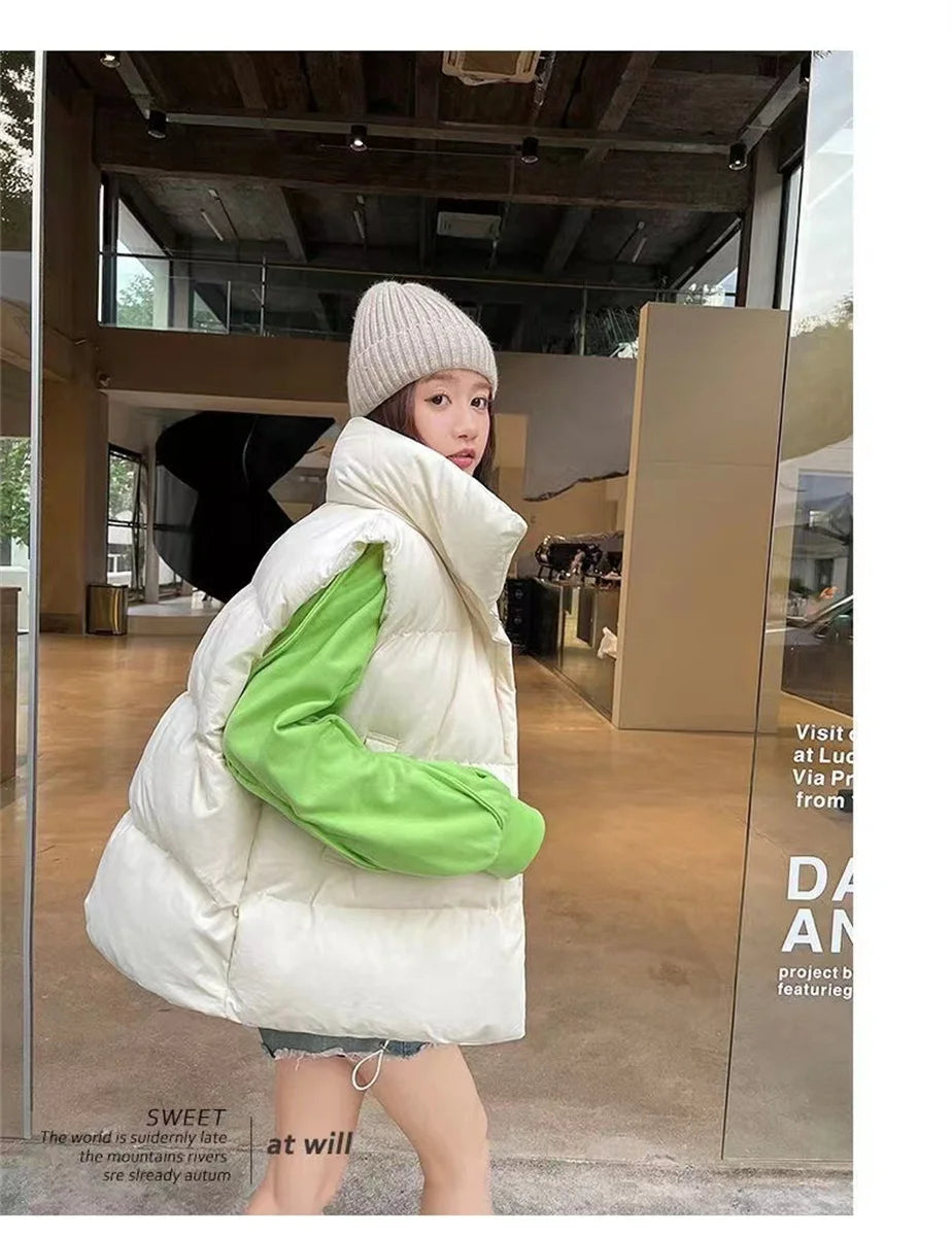 Moda femenina Otoño 2024 Nuevos abrigos de plumas elegantes con cuello alto Prendas de abrigo cálidas Ropa informal Cinturón Sin mangas Chalecos Chaquetas de invierno para mujer