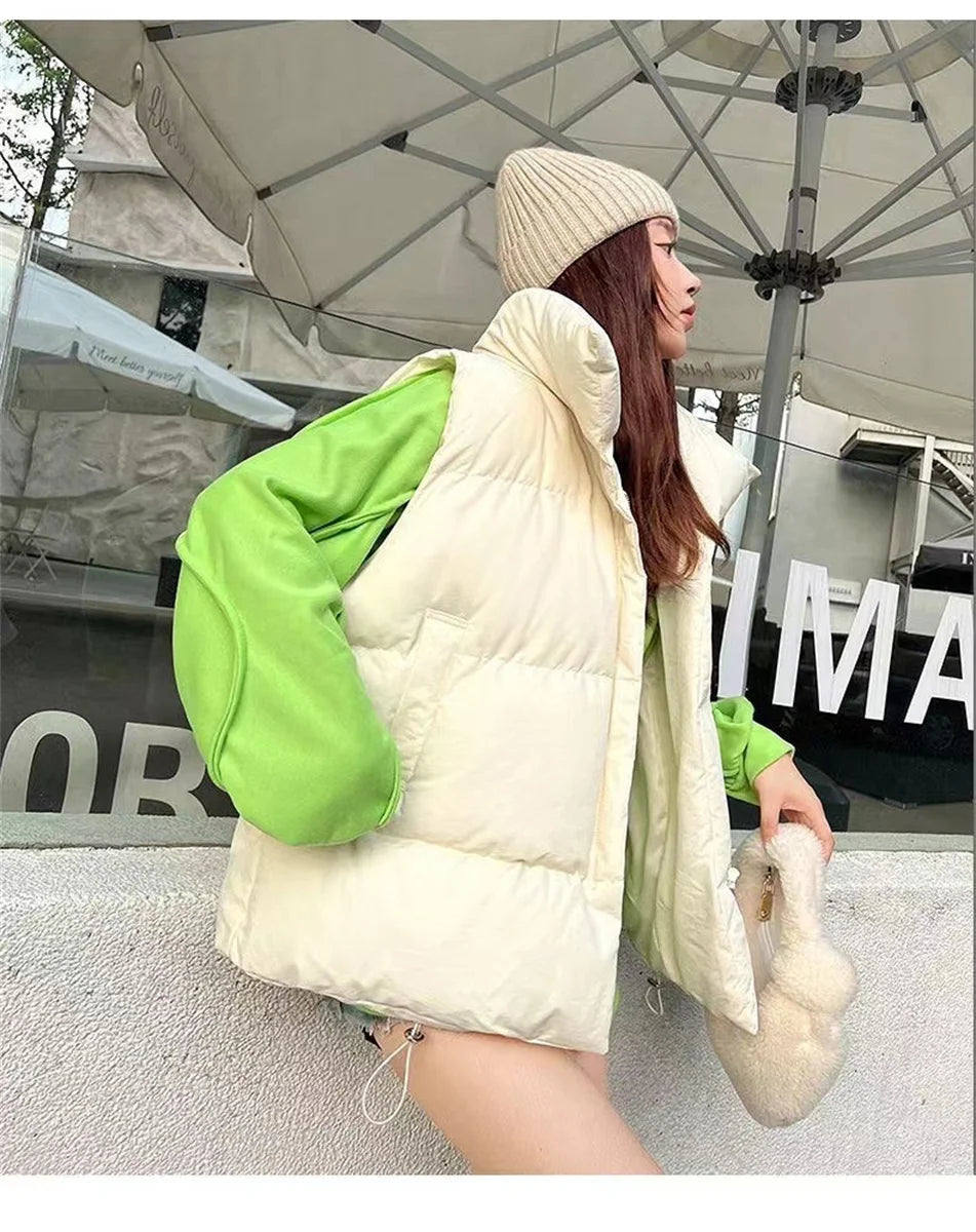 Moda femenina Otoño 2024 Nuevos abrigos de plumas elegantes con cuello alto Prendas de abrigo cálidas Ropa informal Cinturón Sin mangas Chalecos Chaquetas de invierno para mujer