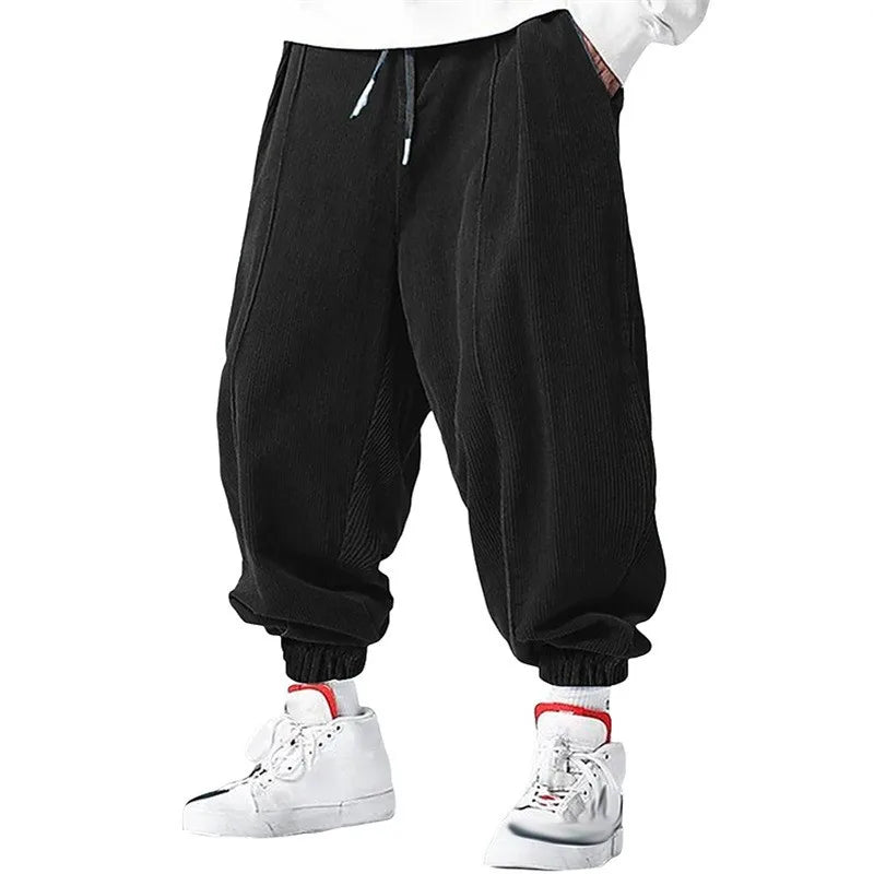 Pantalones casuales holgados con cordón para hombre, ideales para otoño e invierno.