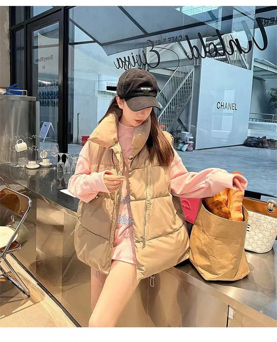 Moda femenina Otoño 2024 Nuevos abrigos de plumas elegantes con cuello alto Prendas de abrigo cálidas Ropa informal Cinturón Sin mangas Chalecos Chaquetas de invierno para mujer