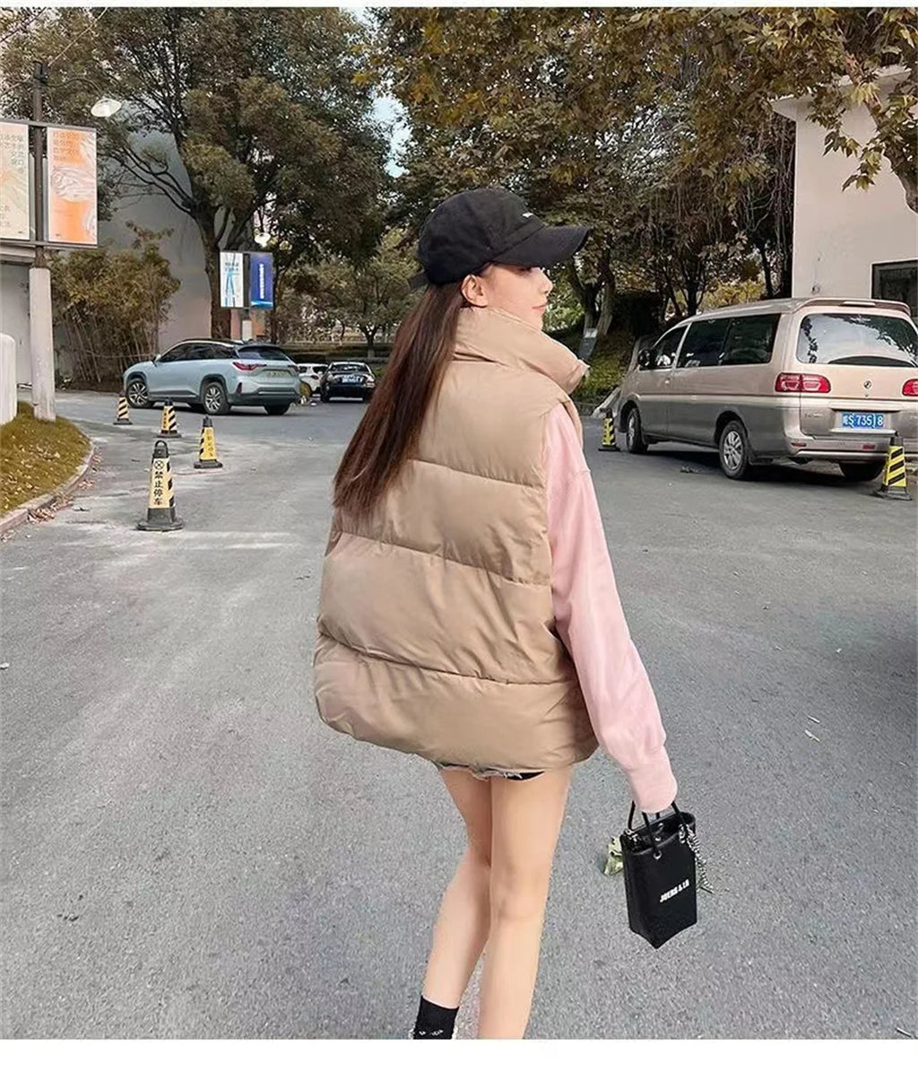 Moda femenina Otoño 2024 Nuevos abrigos de plumas elegantes con cuello alto Prendas de abrigo cálidas Ropa informal Cinturón Sin mangas Chalecos Chaquetas de invierno para mujer